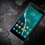 Smartphone with colorful app icons on screen lying on a dark world map background.