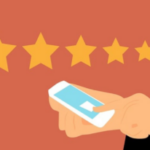 Hand holding smartphone with one star rating selected out of five possible stars against a terracotta background.