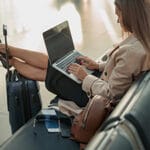 Woman typing on laptop with no privacy screen