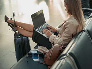 Woman typing on laptop with no privacy screen